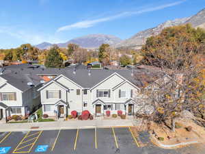 Aerial perspective of suburban area featuring a mountain backdrop