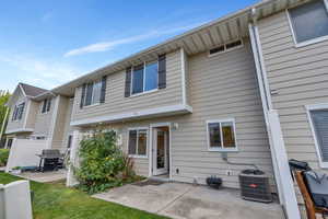 Rear view of home with private patio