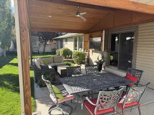 View of patio / terrace featuring a ceiling fan, outdoor dining area, and outdoor lounge area