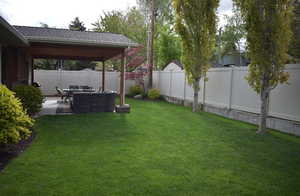 Fenced backyard featuring a patio area