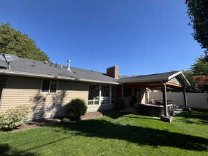 Back of property with a patio, a chimney, roof with shingles, and outdoor lounge area