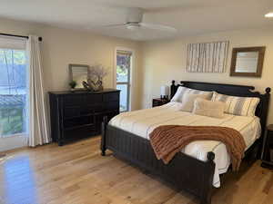 Bedroom featuring wood-type flooring and a ceiling fan