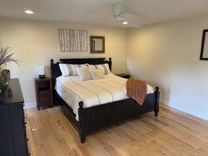 Bedroom with light wood-type flooring, recessed lighting, and ceiling fan