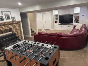 Rec room featuring carpet and baseboards