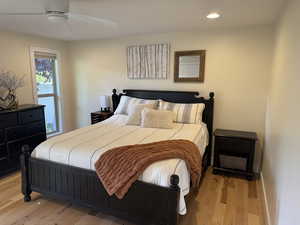 Bedroom featuring light wood finished floors, recessed lighting, and a ceiling fan