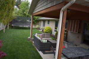 View of yard featuring a trampoline