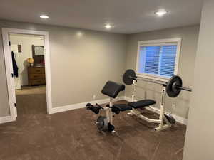 Workout room featuring carpet and recessed lighting