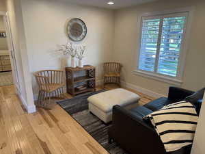 Sitting room featuring light wood-style flooring and recessed lighting