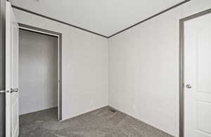 bedroom featuring carpet flooring and crown molding