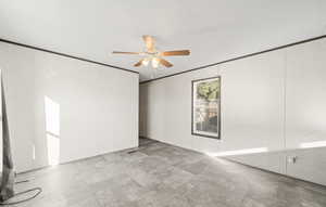 Living area with crown molding and a ceiling fan