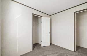 bedroom featuring ornamental molding and carpet flooring