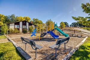 View of community jungle gym and office / clubhouse (currently rented).