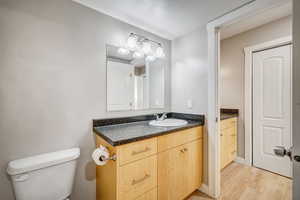Bathroom, with door to the primary bedroom vanity area.