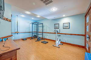 Exercise room featuring recessed lighting