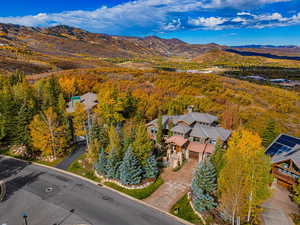 Drone / aerial view of mountains and a heavily wooded area