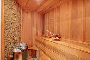 Relaxing sauna / steam room with wooden ceiling