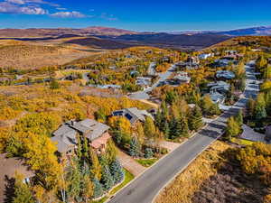 Aerial perspective of suburban area featuring a mountain backdrop