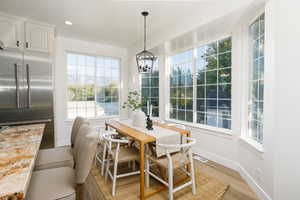 Sunroom / solarium with a chandelier
