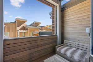 Level one deck off of media room with seating and hot tub.