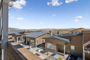 Back of house featuring a mountain view and a metal roof