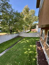 View of fenced backyard