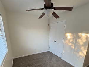 Other Bedroom #3 : Unfurnished bedroom featuring carpet floors, ceiling fan, and a closet