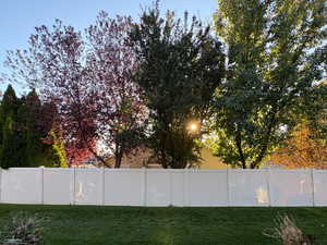 Fenced backyard featuring a patio