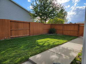 Manicured fenced backyard