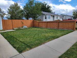 Manicured fenced backyard