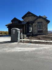 View of front of property with stone siding