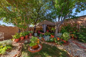 Fenced backyard with a gazebo and a patio