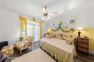 Bedroom with wood finished floors and ceiling fan