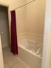 Full bathroom featuring light tile patterned floors
