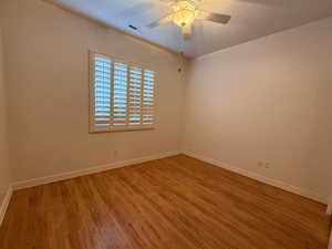 Unfurnished room with light wood-type flooring and a ceiling fan