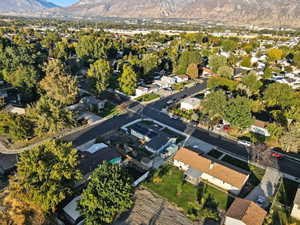 View of property location featuring a mountain backdrop and nearby suburban area