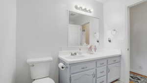 Bathroom with vanity and toilet