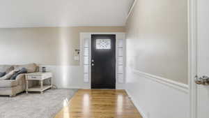 Entrance foyer with wood finished floors