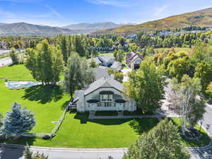 View of subject property with a mountain backdrop