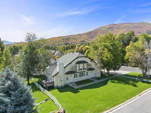 View from above of property with a mountain backdrop