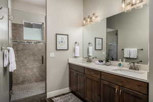 Bathroom with a shower stall and double vanity