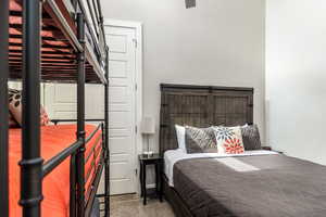 Bedroom with dark colored carpet