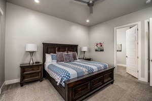 Bedroom featuring light carpet, recessed lighting, and a ceiling fan