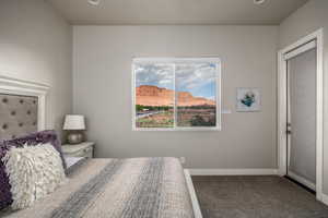 Bedroom with a mountain view, carpet floors, and recessed lighting