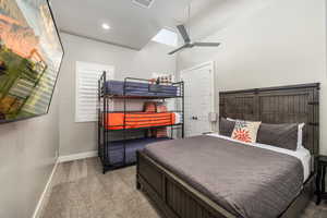Bedroom featuring carpet flooring, ceiling fan, and lofted ceiling