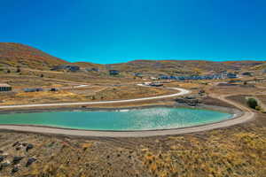 View of pool featuring a water and mountain view