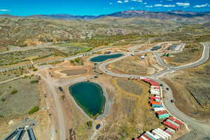 View of property location featuring a water and mountain view