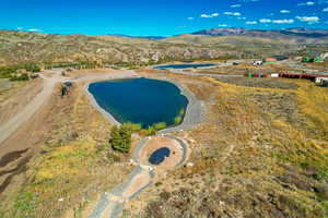 Aerial overview of property's location with a water and mountain view