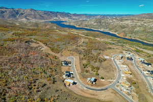 Aerial overview of property's location with a water and mountain view
