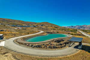 View of pool with a mountain view