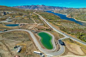 View of property location with a water and mountain view
